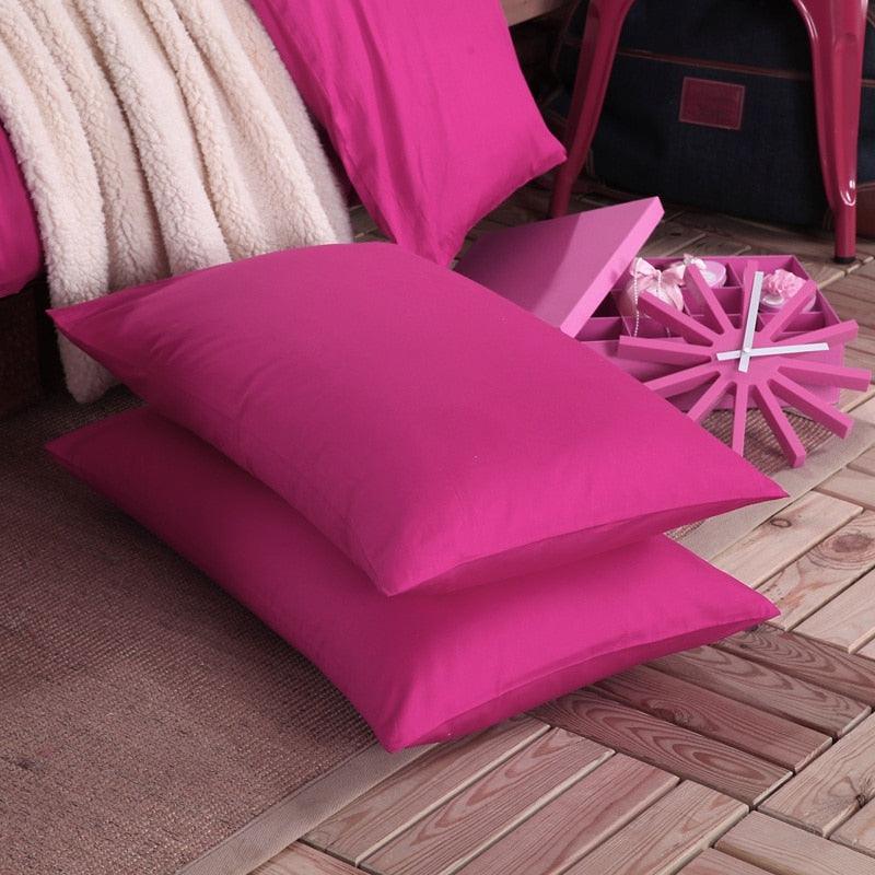 100% Cotton hot pink pillowcases on the floor next to the 100% hot pink Duvet Cover Set - Fluffyslip