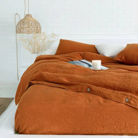caramel color 100% french linen duvet cover set with two matching pillows in a white room - Fluffyslip