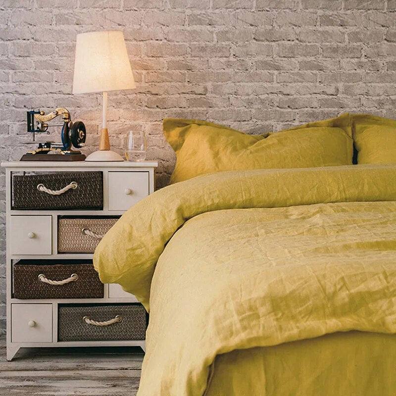 ginger color 100% French Linen Duvet Set in a bedroom with a brick wall and a antique record player sitting on a night stand - Fluffyslip