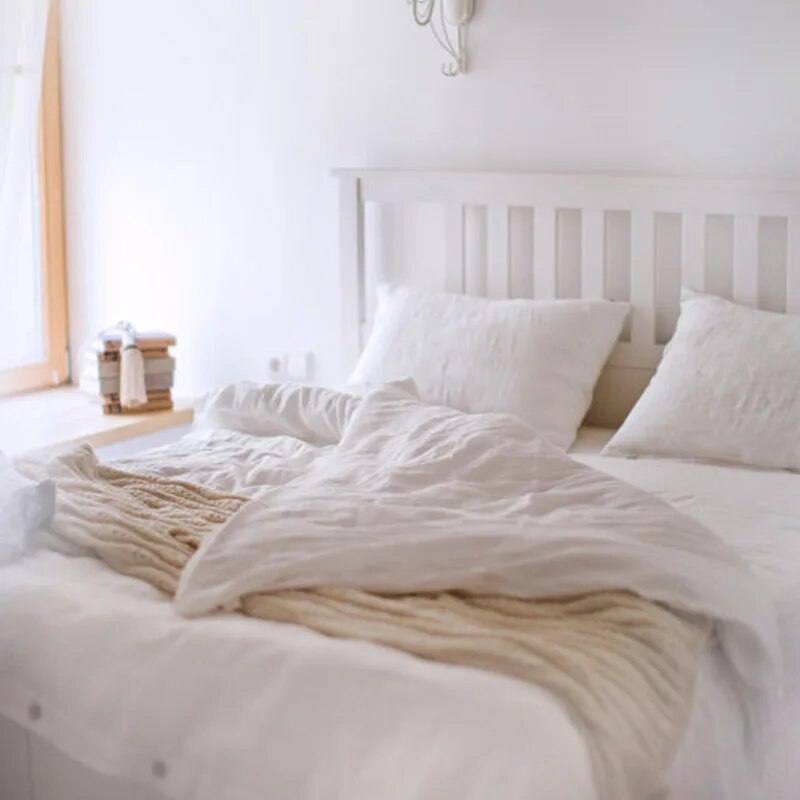 bleach color 100% french linen duvet cover set with two matching pillows in a white room - Fluffyslip