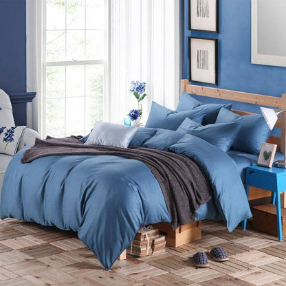 100% Cotton Duvet Cover Set in the color blue with matching blue pillowcases in a full bedroom setup - Fluffyslip
