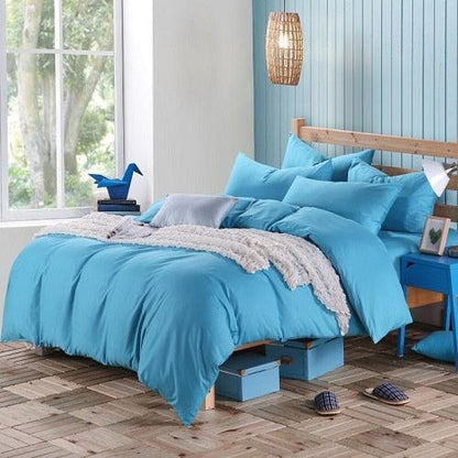 100% Cotton Duvet Cover Set in the color soft blue with matching soft blue pillowcases in a full bedroom setup - Fluffyslip