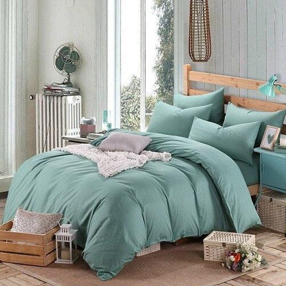 100% Cotton Duvet Cover Set in the color teal with matching teal pillowcases in a full bedroom setup - Fluffyslip