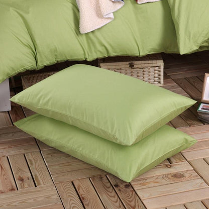 100% Cotton mint green pillowcases on the floor next to the 100% mint green Duvet Cover Set - Fluffyslip