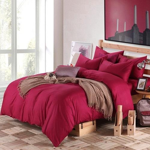 100% Cotton Duvet Cover Set in the color red with matching red pillowcases in a full bedroom setup - Fluffyslip
