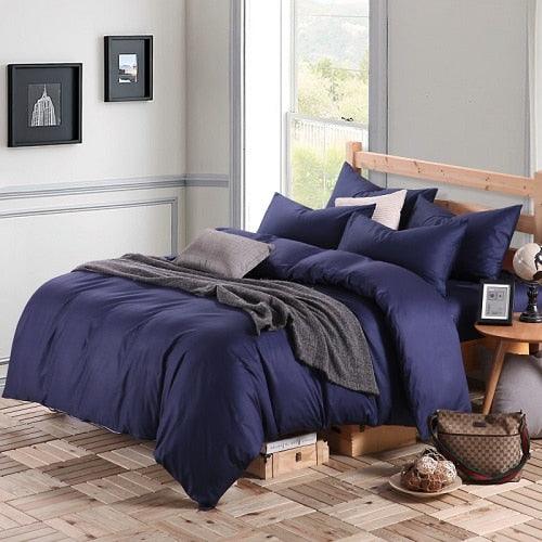100% Cotton Duvet Cover Set in the color navy blue with matching navy blue pillowcases in a full bedroom setup - Fluffyslip