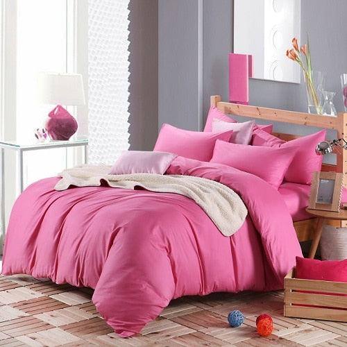 100% Cotton Duvet Cover Set in the color pink with matching pink pillowcases in a full bedroom setup - Fluffyslip