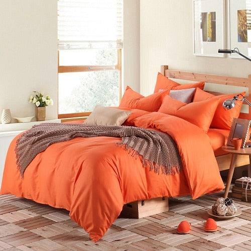 100% Cotton Duvet Cover Set in the color orange with matching orange pillowcases in a full bedroom setup - Fluffyslip