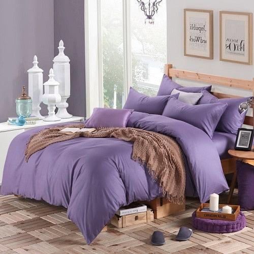 100% Cotton Duvet Cover Set in the color purple with matching purple pillowcases in a full bedroom setup - Fluffyslip