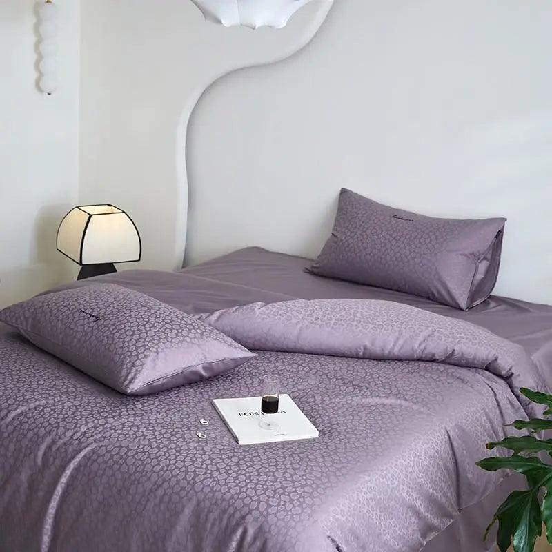 600TC Egyptian Cotton Diamond Wave Pattern Duvet Set in purple with a glass of red wine at the foot of the bed - Fluffyslip