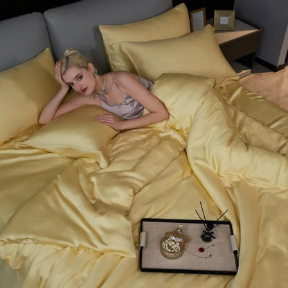 woman in a luxurious night gown laying down on a Yellow Eucalyptus Lyocell Cooling Duvet Cover Set in a luxury bedroom - Fluffyslip 