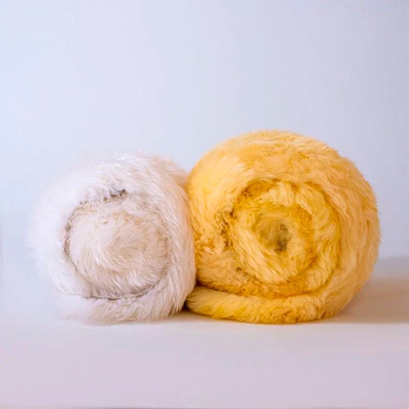 Yellow and white heavyweight merino wool blanket rolled up 