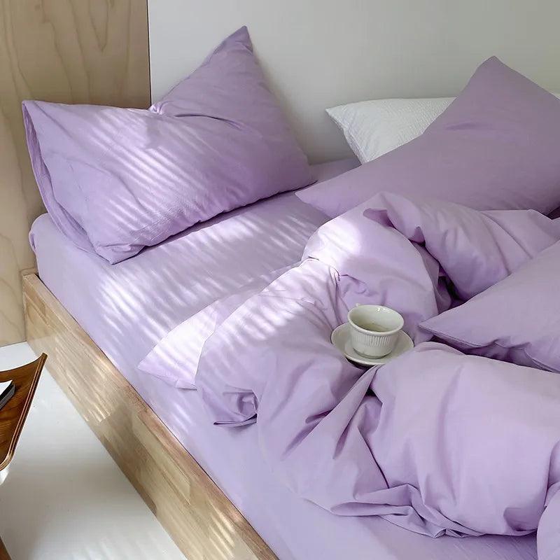 Vibrant Washed Cotton Color Duvet Cover Set in the color lilac in a minimalistic style bedroom with a tea cup on display- Fluffyslip