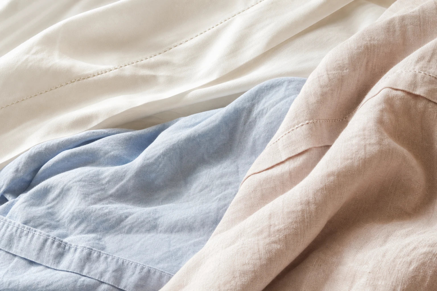 Close view of soft layered bedding fabrics and stitching